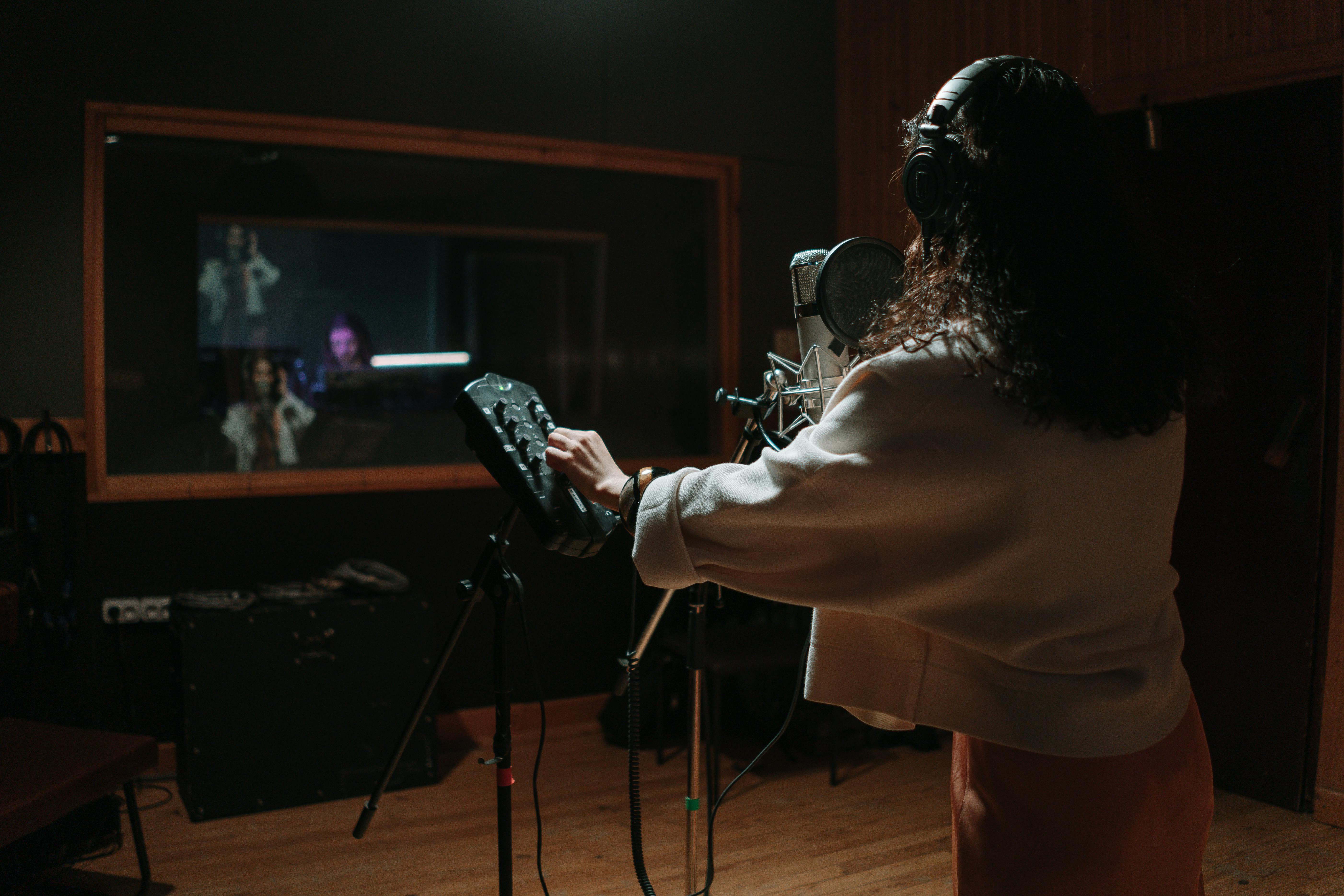 Voice artist recording in booth